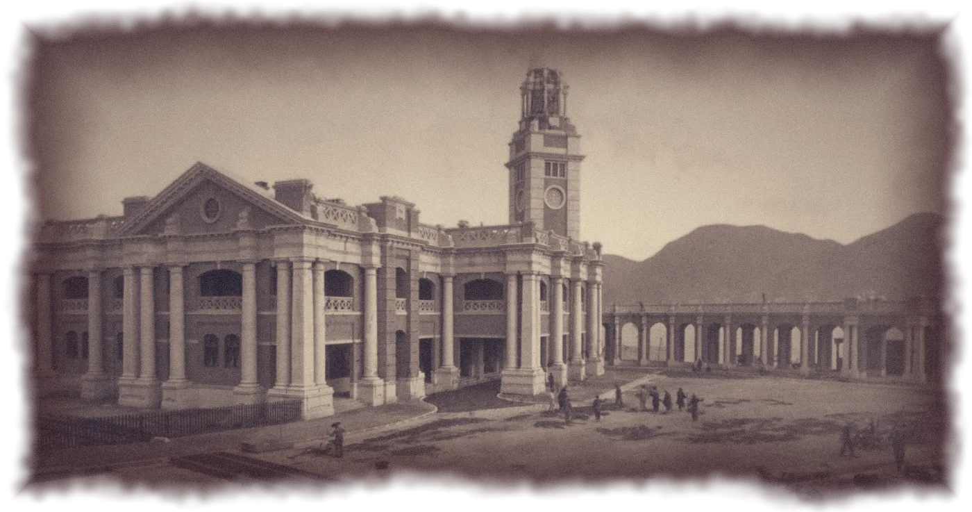 Photograph of the newly built Kowloon railway terminus and its clock tower, rickshaws waiting in the forecourt